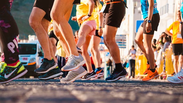 Group of runners participating in a city marathon during daylight.